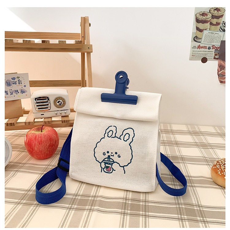 A versatile canvas bag for women in stock, a new student Korean version crossbody bag, a large-capacity Japanese style simple cartoon clip bag details Picture