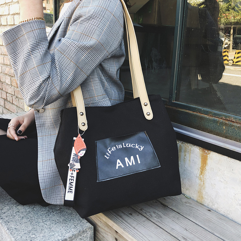 2021 Autumn New Korean-style large-capacity canvas bag, simple and casual hand-held bag, shoulder bag, shopping bag, tote bag for women details Picture