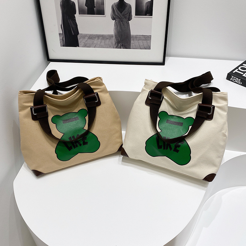 Large-capacity fashionable bags are selling well. New high-end style class bear canvas bags, student hand and shoulder tote bags for girls details Picture