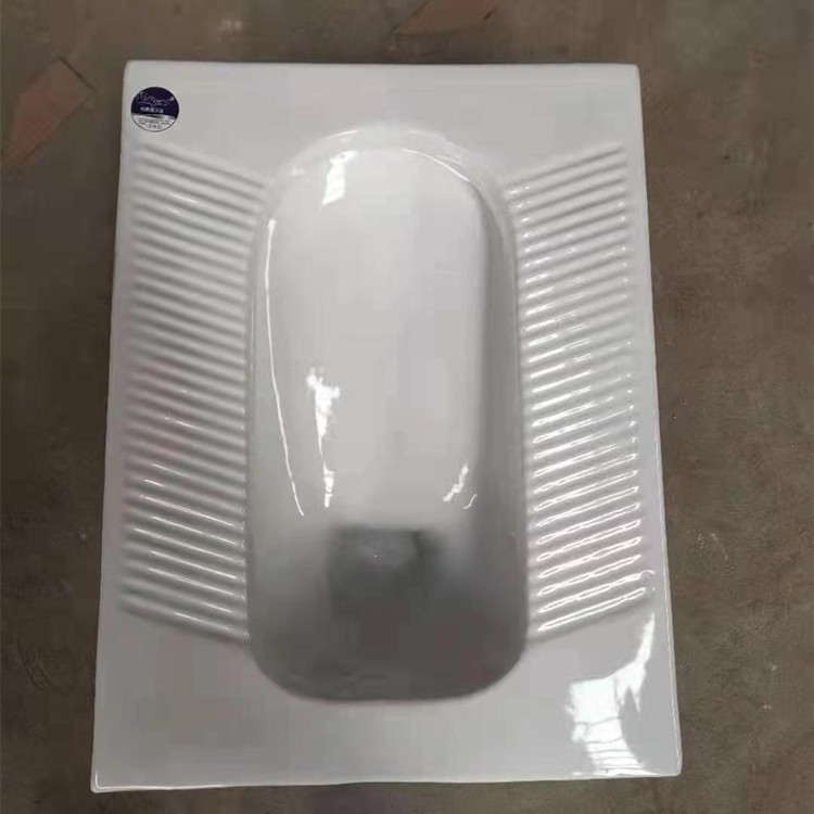 Toilet fixtures, squat toilet with curved squat pit, squat toilet, bathroom equipped with wall-mounted water tank, toilet bowl, anti-odor stomp Application Scenario
