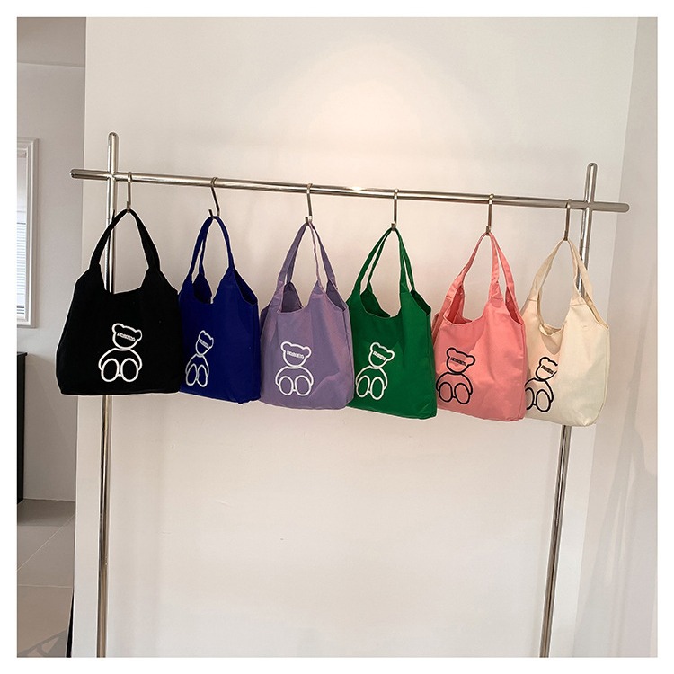 New Japanese-style cute canvas bag for students, large-capacity single-shoulder bag, a niche and versatile hand-held cloth bag for women, wholesale full figure