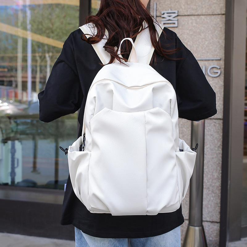 High-end men's large-capacity backpacks, women's simple and versatile school bags, junior high school and primary school students' backpacks, student bags full figure