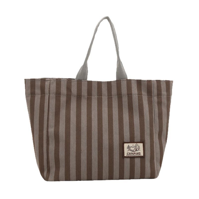 The new large-capacity casual handbag, fashionable and versatile, simple commuting tote bag, and student class tutorial bag are selling well Item Picture