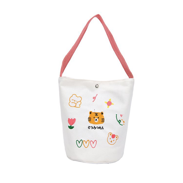 Japanese-style cute cartoon tiger girl hand-held bucket bag, women's printed canvas bag, student lunch cylinder bento bag Item Picture
