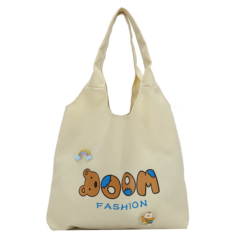 2021 Summer Japanese-style simple canvas bag, student backpack, single-shoulder handbag for going out, cartoon badge cotton bag Item Picture