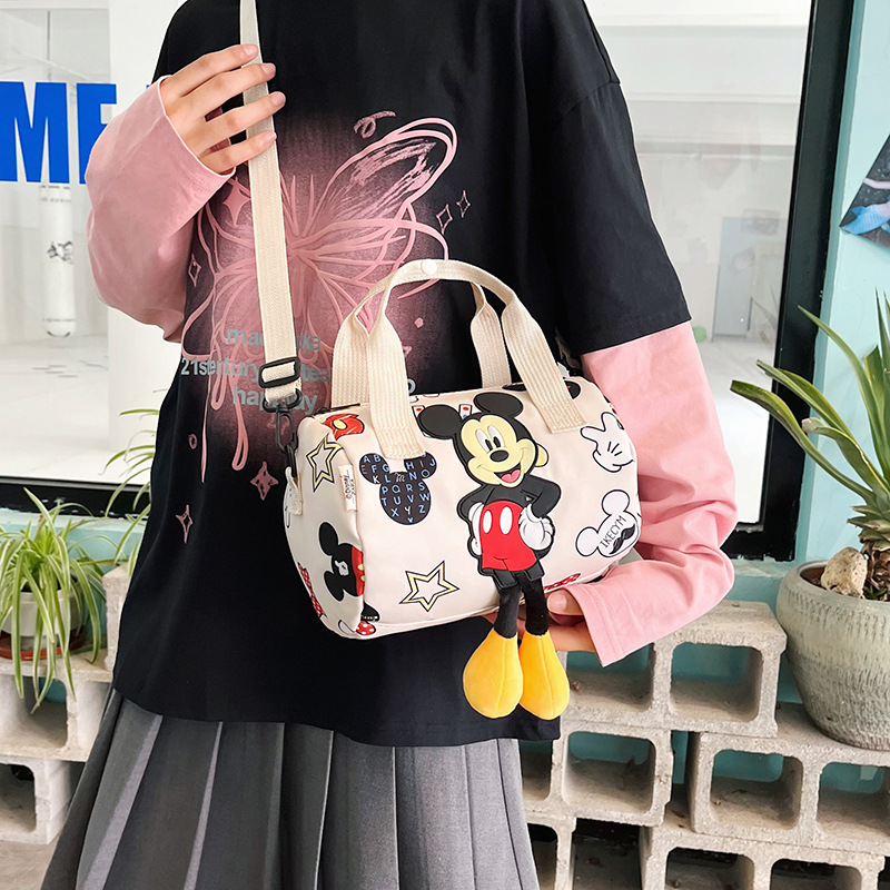 In 2024, the best-selling children's bags will feature cute Mickey Mouse-patterned bowling bags for girls, casual hand-held shoulder bags, and a unique style details Picture