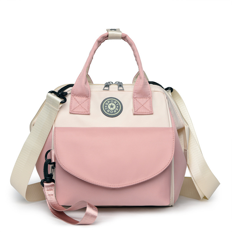 The Mommy bag is small and cute. It has a detachable front pocket and is a multi-functional baby bag. It is waterproof, lightweight, and has a crossbody design. It can be used to carry milk bags Item Picture