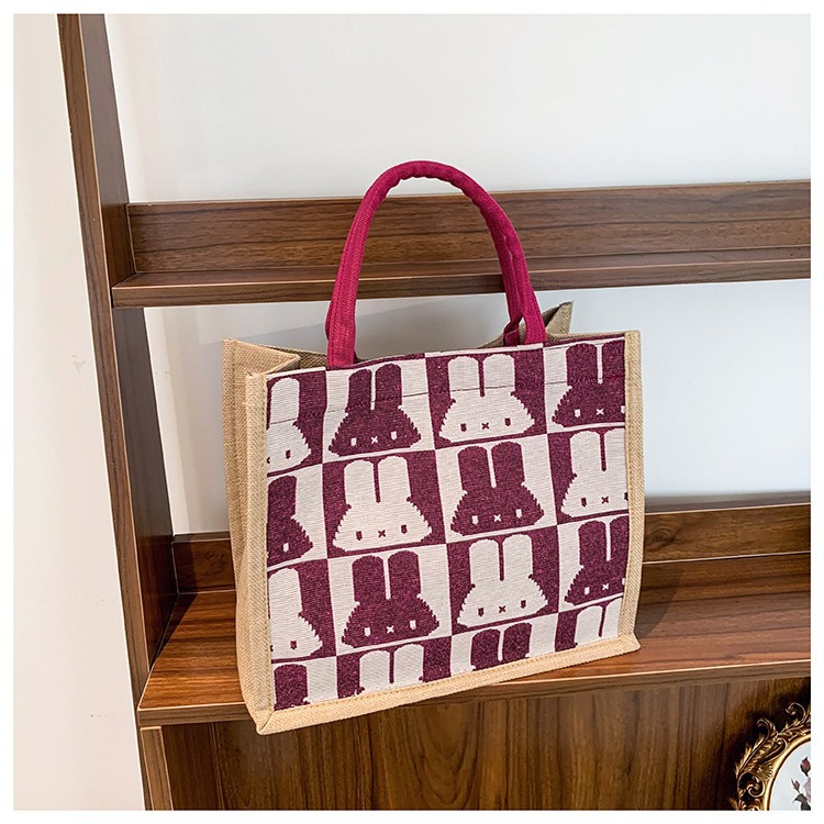High-end mid-capacity canvas school commuting handbag 2024 new style fashionable and versatile linen single-shoulder tote bag details Picture