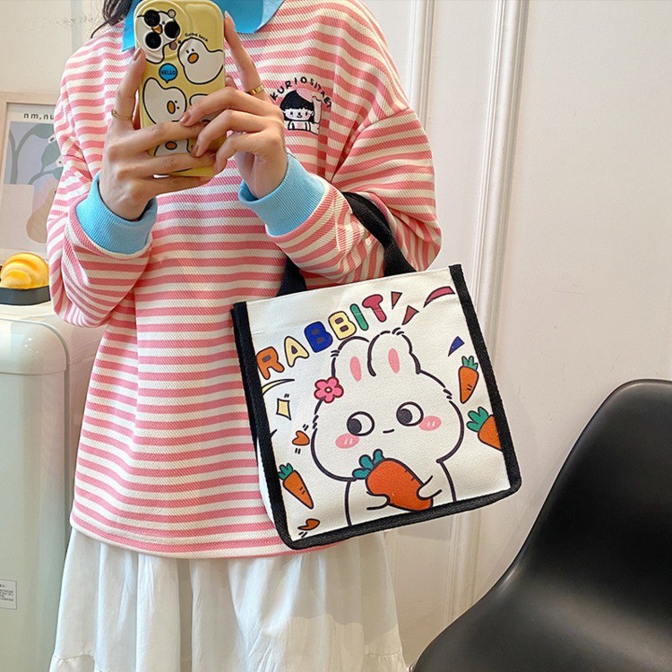 Wholesale of new Japanese-style cute canvas bags with little rabbit prints, cartoon girl tutorial bags, and portable bento bags for going out Specification drawing