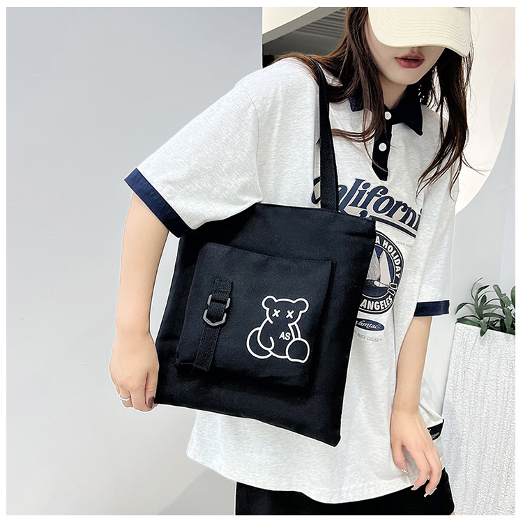 Large-capacity women's bag manufacturer in stock, fashionable Korean-style single-shoulder canvas bag, ins, high school and college students' hand-held tutorial bag Application Scenario
