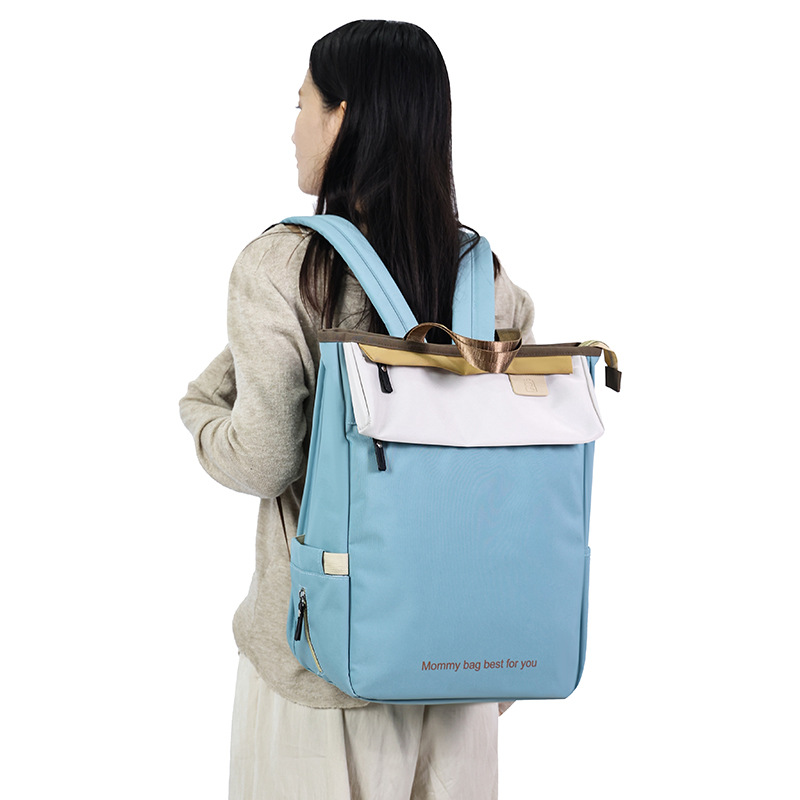 The new Mommy Bag is a lightweight backpack for mother and baby outings with a large capacity. The new 2024 Mommy and Daddy hand-held backpack Application Scenario