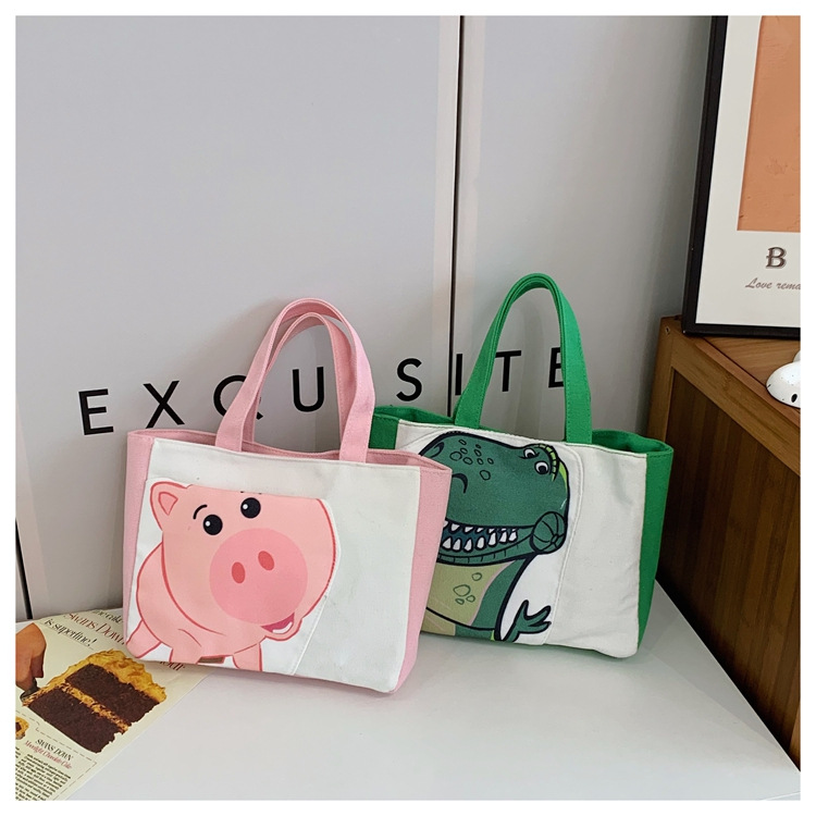 Cute cartoon printed small bag, 2024 summer new style hand-held piggy girl handbag, student storage canvas bag details Picture