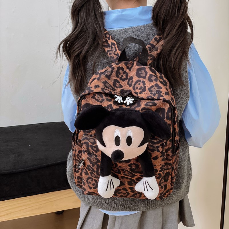 The 2025 new leopard-print backpack is a fashionable female figurine backpack with a large capacity and cute dolls. It is a best-selling student schoolbag Application Scenario