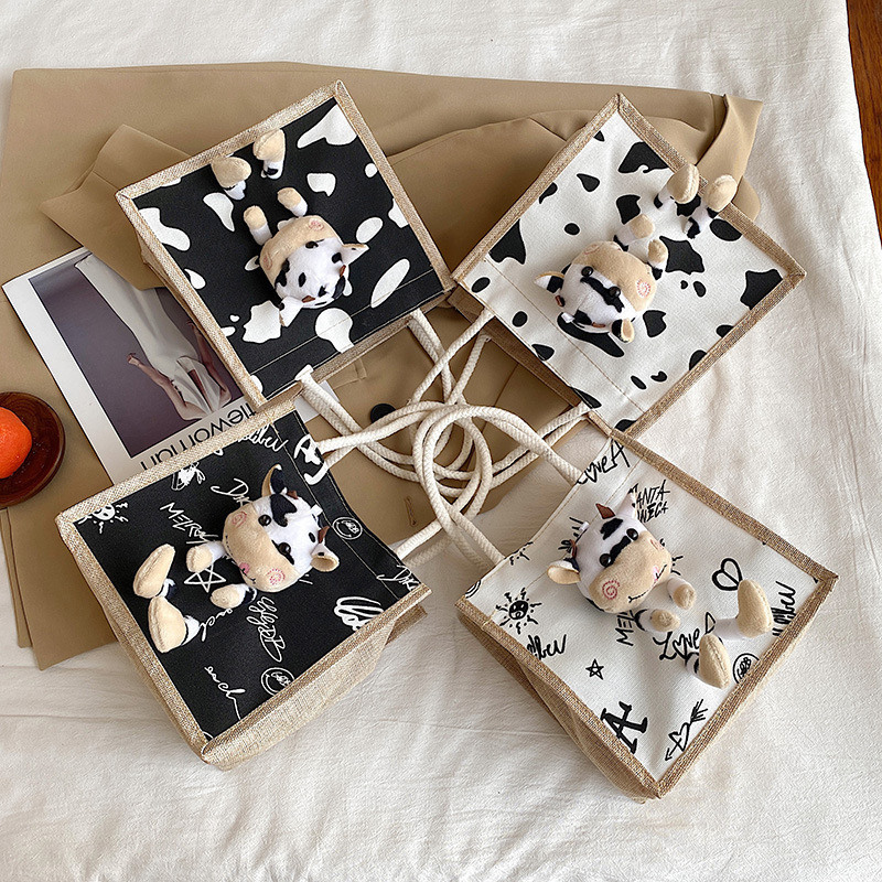 Cute calf canvas bag for women, 2020 new style personalized graffiti bento bag, trendy on Instagram, trendy hand-held bag full figure