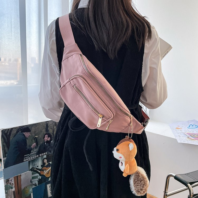 A lady's Korean-style waist bag with multiple layers, a close-fitting mobile phone bag for outdoor travel, a casual, fashionable, trendy and high-end crossbody bag details Picture