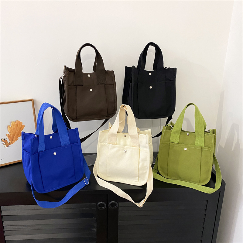 Casual Japanese-style small bag 2024 Summer new student solid color canvas crossbody bag, women's single-shoulder hand-held small square bag full figure