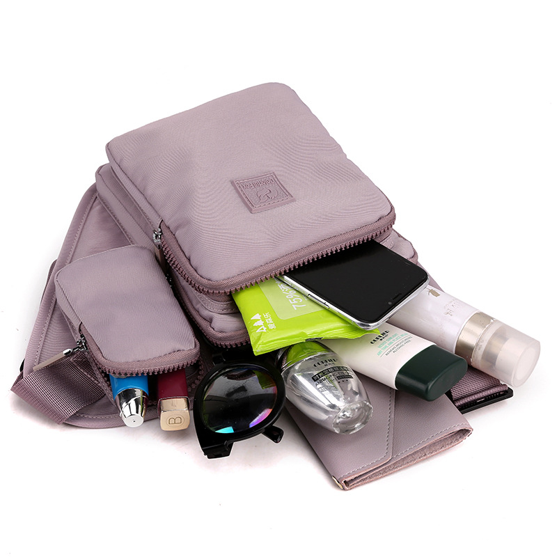 Cross-border exclusive women's fashionable and trendy vest bag, Japanese-style casual multi-layer crossbody bag, portable mobile phone waterproof backpack Application Scenario