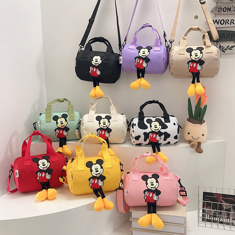 The 2021 new children's bags feature a cute Mickey Mouse pattern bowling bag for girls and a fashionable hand-held shoulder bag full figure
