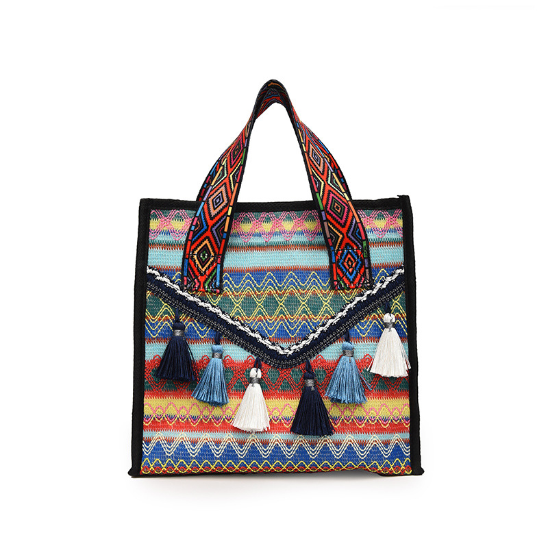 New hand-held fringed shopping bag 2022, fashionable ethnic style, Hong Kong style bucket bag, versatile woven bag for women Item Picture