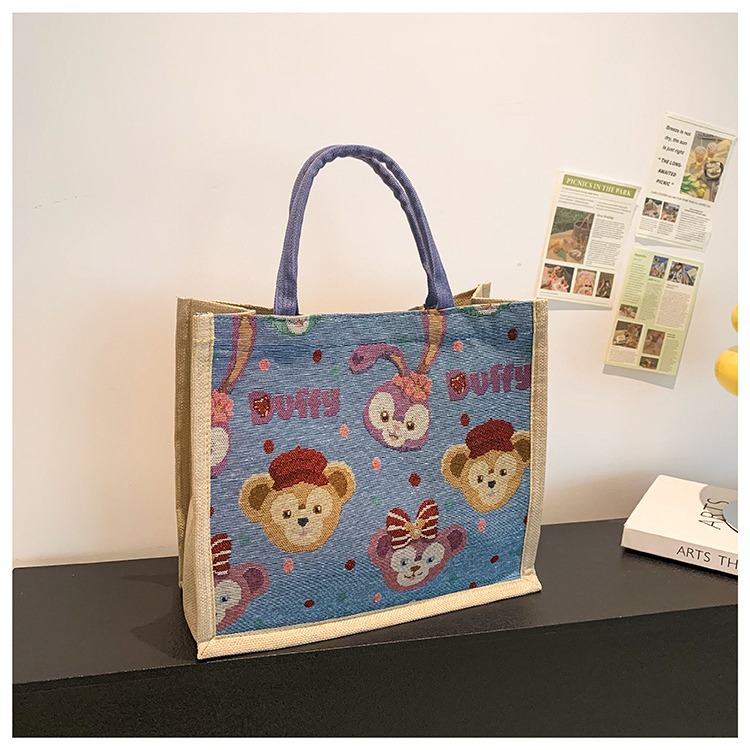 Wholesale of new Korean cartoon large-capacity tote bags and trendy canvas bags in linen fashion for women details Picture