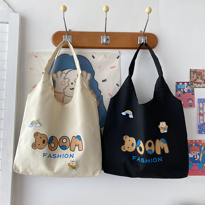 2021 Summer Japanese-style simple canvas bag, student backpack, single-shoulder handbag for going out, cartoon badge cotton bag full figure