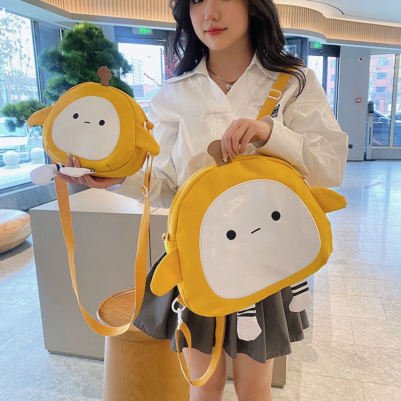 The new 2024 children's egg-shaped party backpack is a cute cartoon canvas single-shoulder bag and a fashionable and stylish small backpack full figure