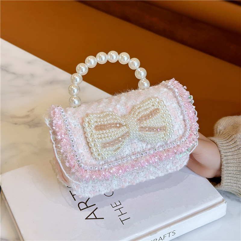 Spring 2025 New sequined pearl bow girl princess hand-held crossbody accessory loose change bag full figure