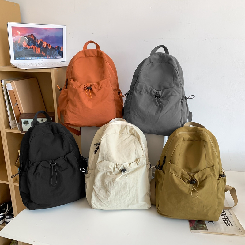 2025 Korean version New large-capacity nylon fabric backpack, lightweight and casual commuting backpack, Haraju-style student schoolbag Application Scenario