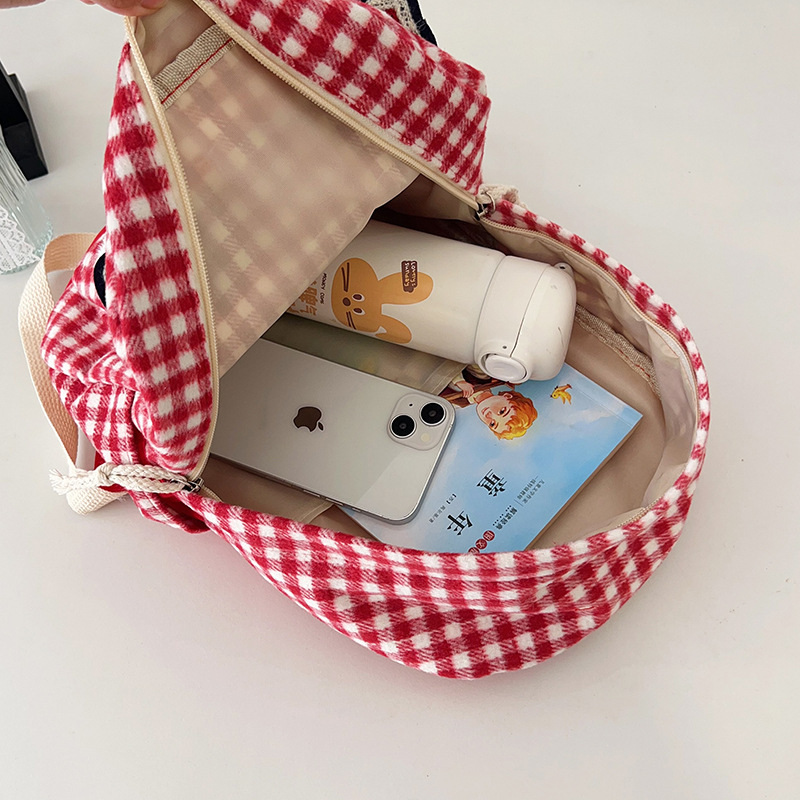 The large-capacity red woolen checkered backpack for primary and secondary school students is a unique and versatile choice. It's a trend for girls to carry backpacks during their leisure trips Application Scenario
