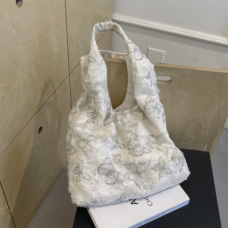 A large-capacity commuting single-shoulder bag for 2024, a super popular summer embroidered large bag for women, a niche tote bag with a sense of design details Picture