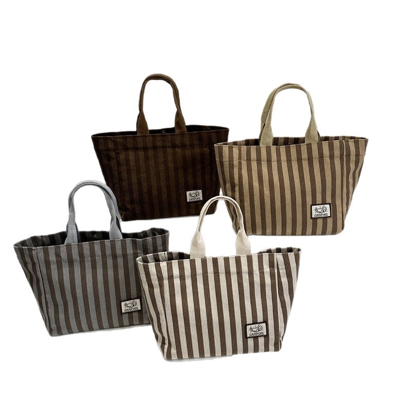 Striped canvas bag for women 2025 new style, fashionable and artistic hand-held bag, large-capacity tote bag for work and commuting Item Picture