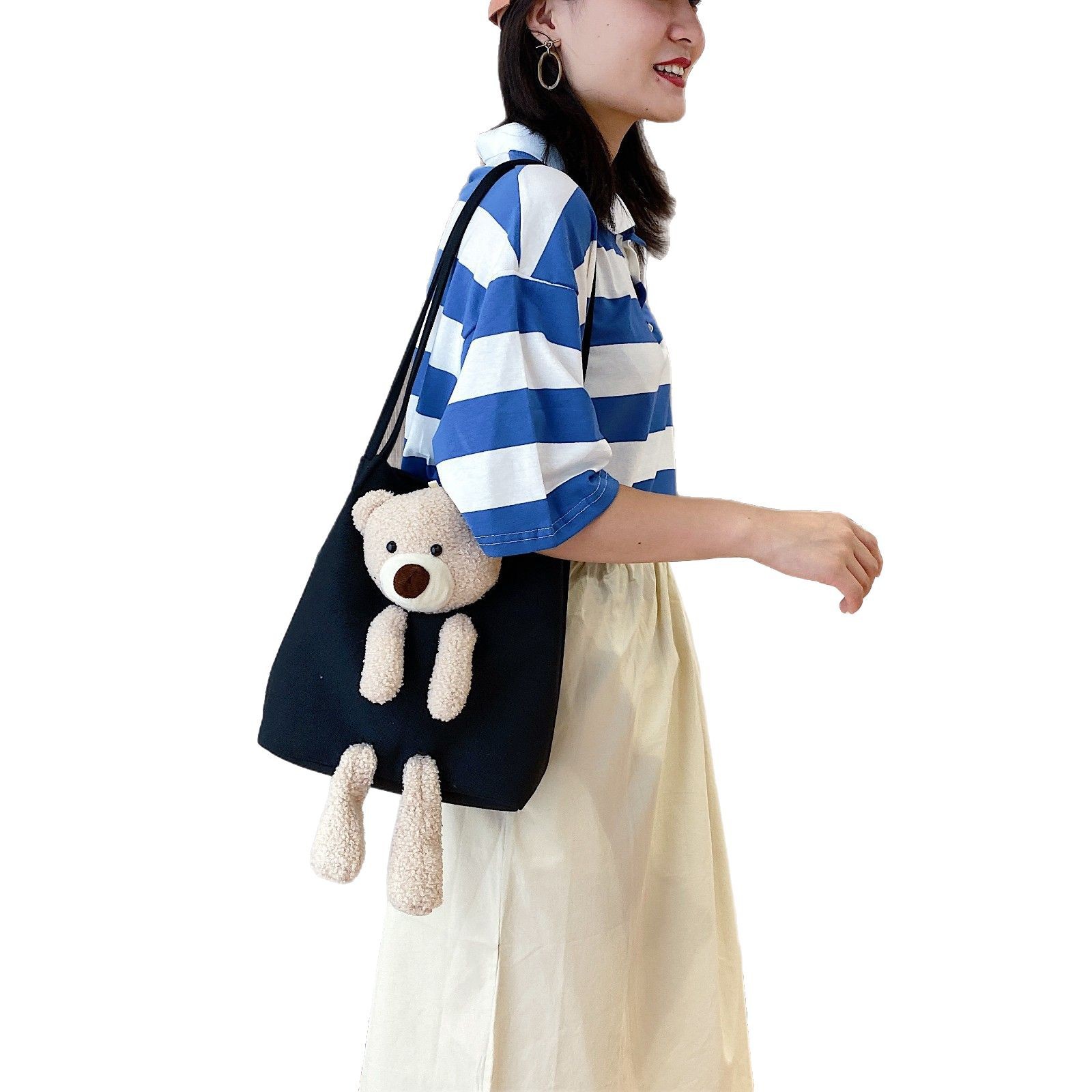 The new internet-famous canvas bear doll single-shoulder bag is a trendy item for going out. It's a simple bucket bag for beautiful girls and a fashionable and versatile women's bag Item Picture