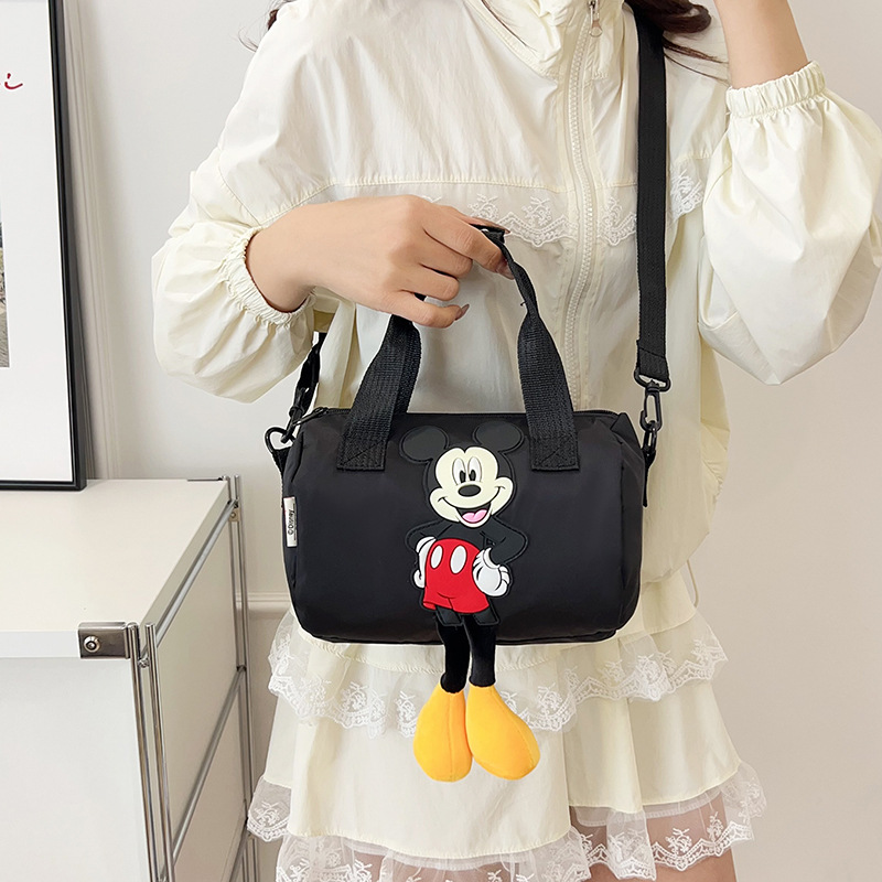 The 2021 new children's bags feature a cute Mickey Mouse pattern bowling bag for girls and a fashionable hand-held shoulder bag details Picture