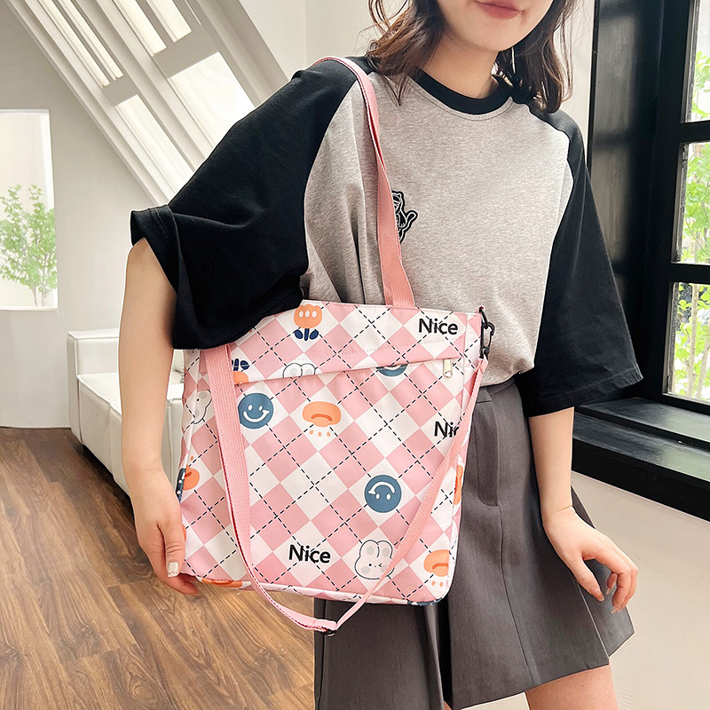 New nylon large-capacity hand-held student storage bag, cute cartoon outdoor bento bag, high appearance level single-shoulder women's bag full figure