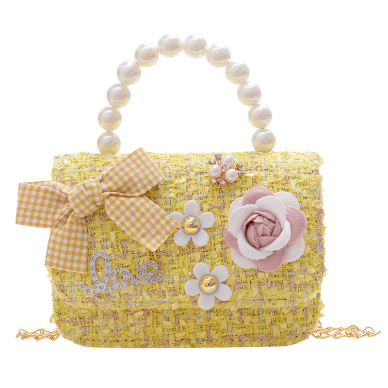 2025 New Korean version woolen, cotton and linen girls' and children's bow pearl hand-held accessory handbag Item Picture