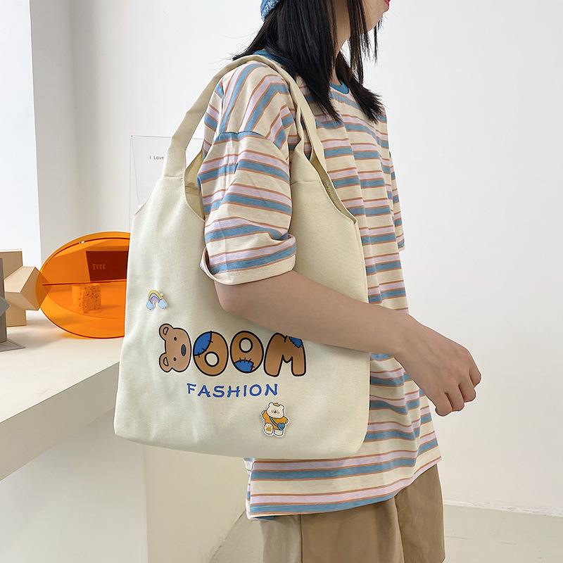 2021 Summer Japanese-style simple canvas bag, student backpack, single-shoulder handbag for going out, cartoon badge cotton bag details Picture