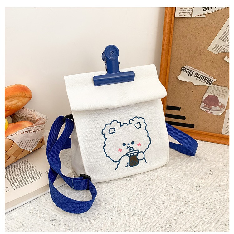 A versatile canvas bag for women in stock, a new student Korean version crossbody bag, a large-capacity Japanese style simple cartoon clip bag Specification drawing
