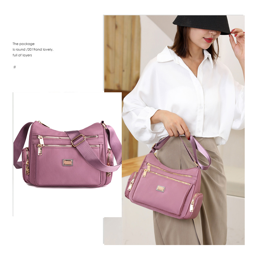 The 2025 new women's crossbody bag, a nylon color-blocking single-shoulder bag, is designed as a large-capacity, multi-layered, simple middle-aged mom bag Application Scenario