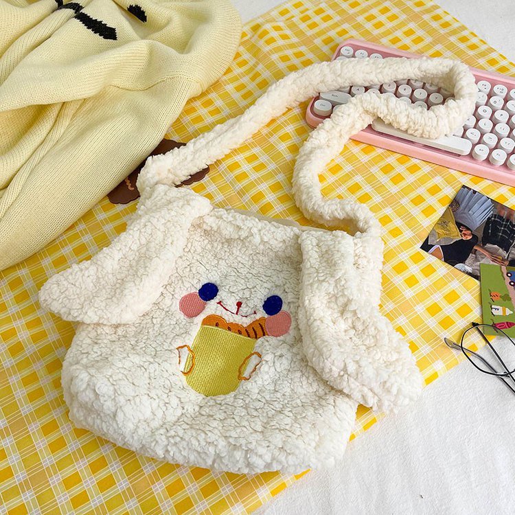 This autumn and winter hand-held bag with big ears, cute animal-embroidered fur, and a simple lambskin large-capacity student backpack Specification drawing