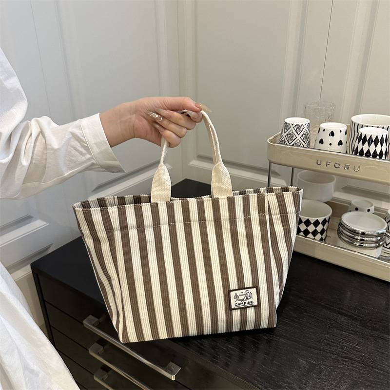 Striped canvas bag for women 2025 new style, fashionable and artistic hand-held bag, large-capacity tote bag for work and commuting details Picture