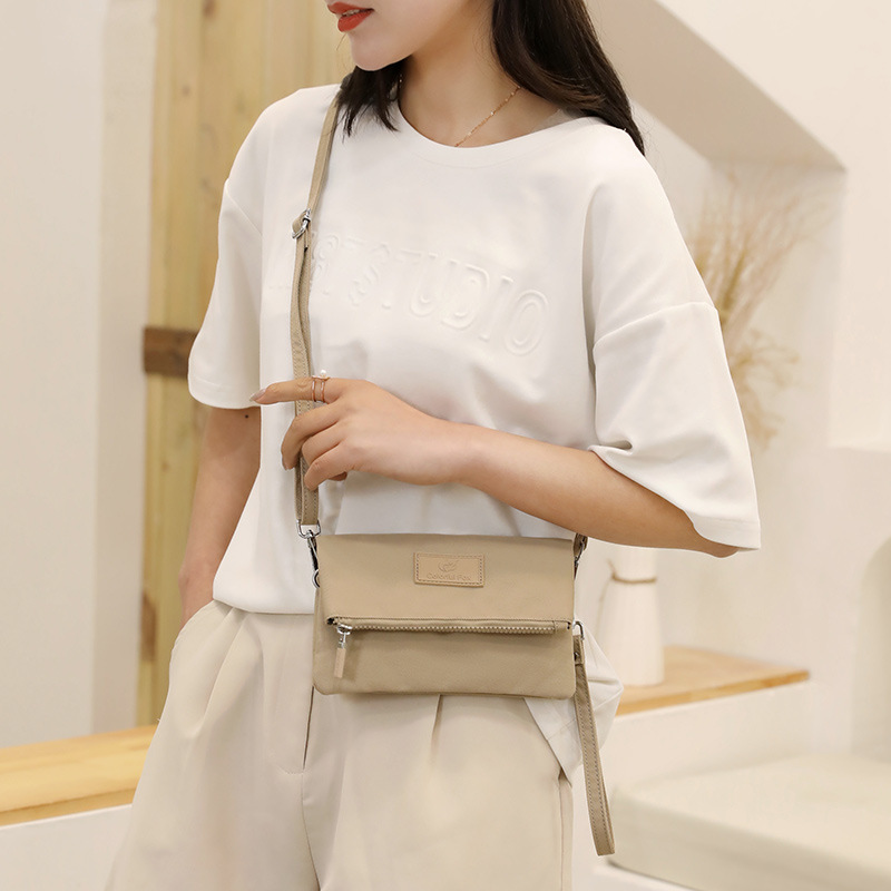 Wholesale 2025 summer new women's crossbody bag, Korean-style fashionable and simple single-shoulder bag, cash register change handbag details Picture