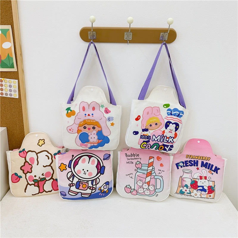 Wholesale cartoon canvas bags, female student tutorial bags, Japanese-style illustration large-capacity single-shoulder bags, cute hand-carry bags full figure