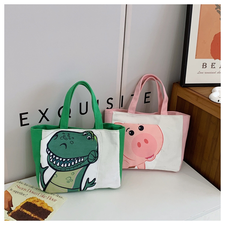 Cute cartoon printed small bag, 2024 summer new style hand-held piggy girl handbag, student storage canvas bag full figure