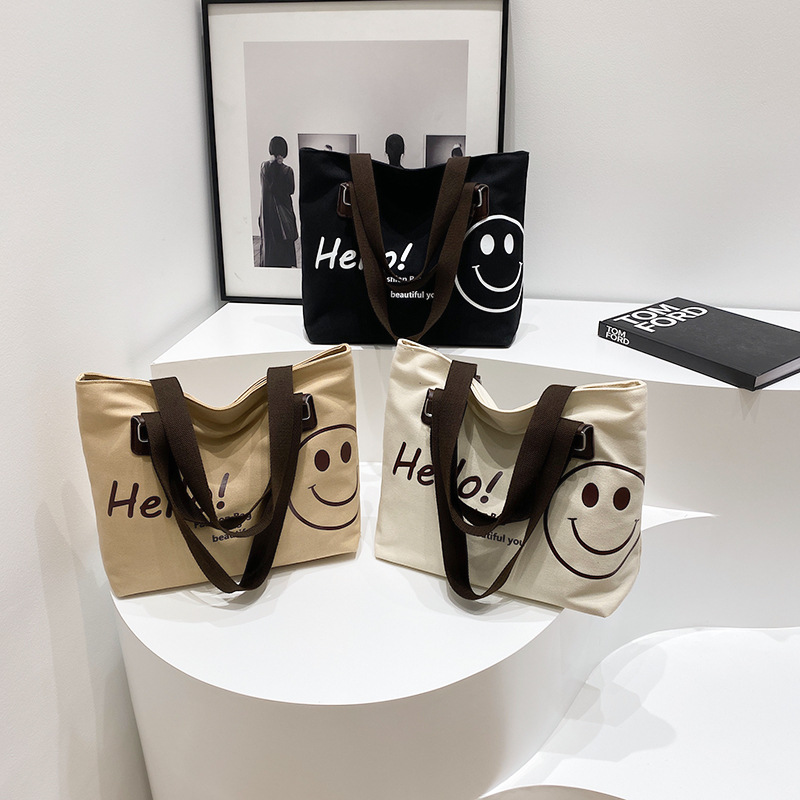 Wholesale of 2024 new Korean-style casual student canvas bags with a large capacity and smiling face full figure