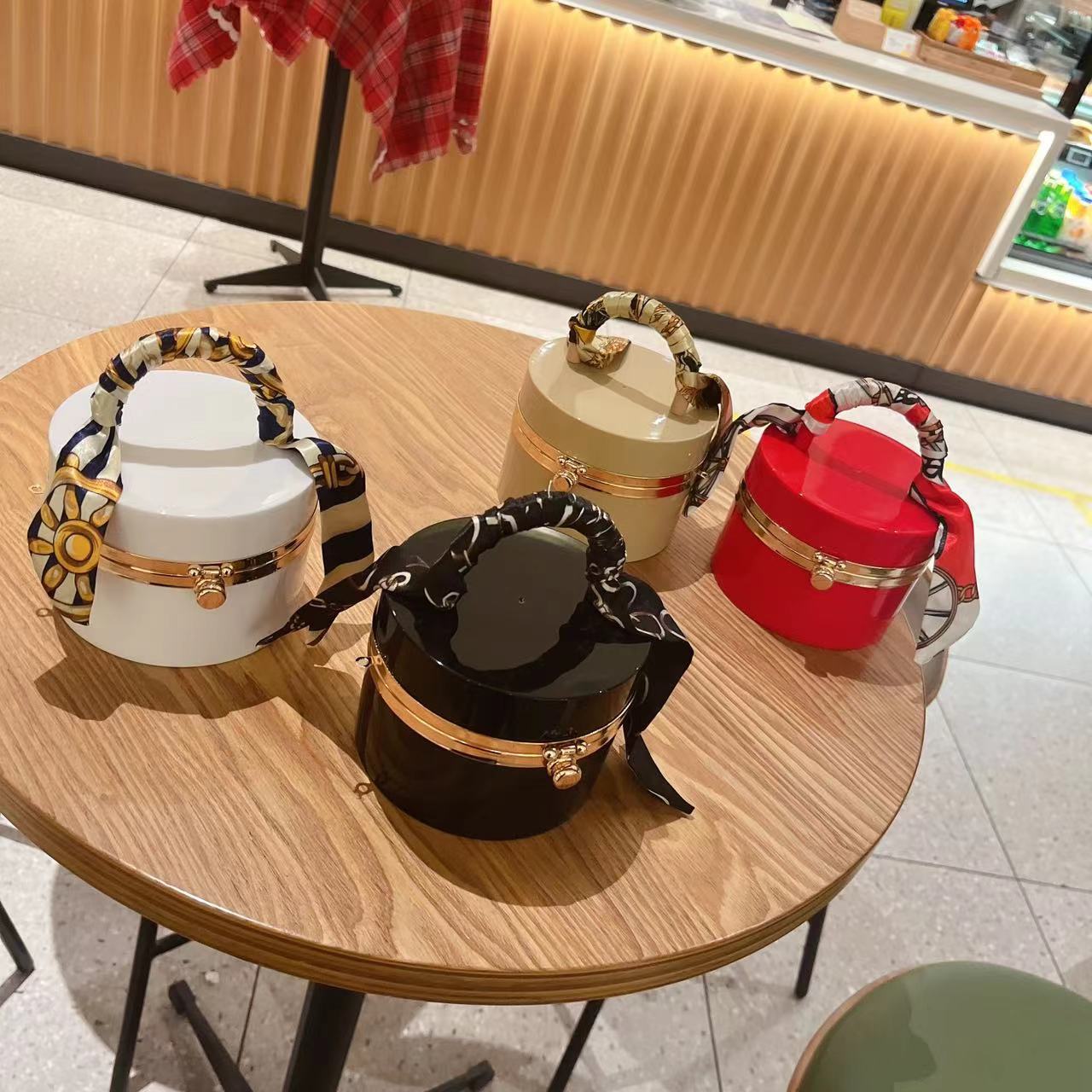 The 2025 new style women's bag is a trendy and fashionable candy-colored acrylic bag, a hand-held silk scarf, a lockable dinner bag, and a box bag details Picture