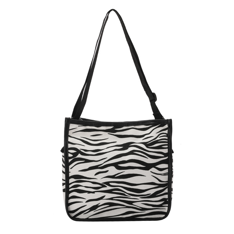 A cute hand-held canvas bag, a new trendy lady's cow pattern Japanese-style small square bag, a Haraju-style striped single-shoulder crossbody bag Item Picture