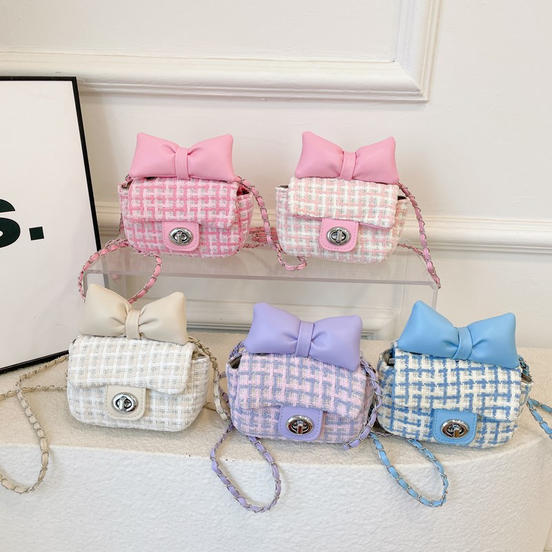 The 2024 autumn collection of trendy children's bags features a sweet bow crossbody bag for kids and a stylish checkered cute girl bag full figure