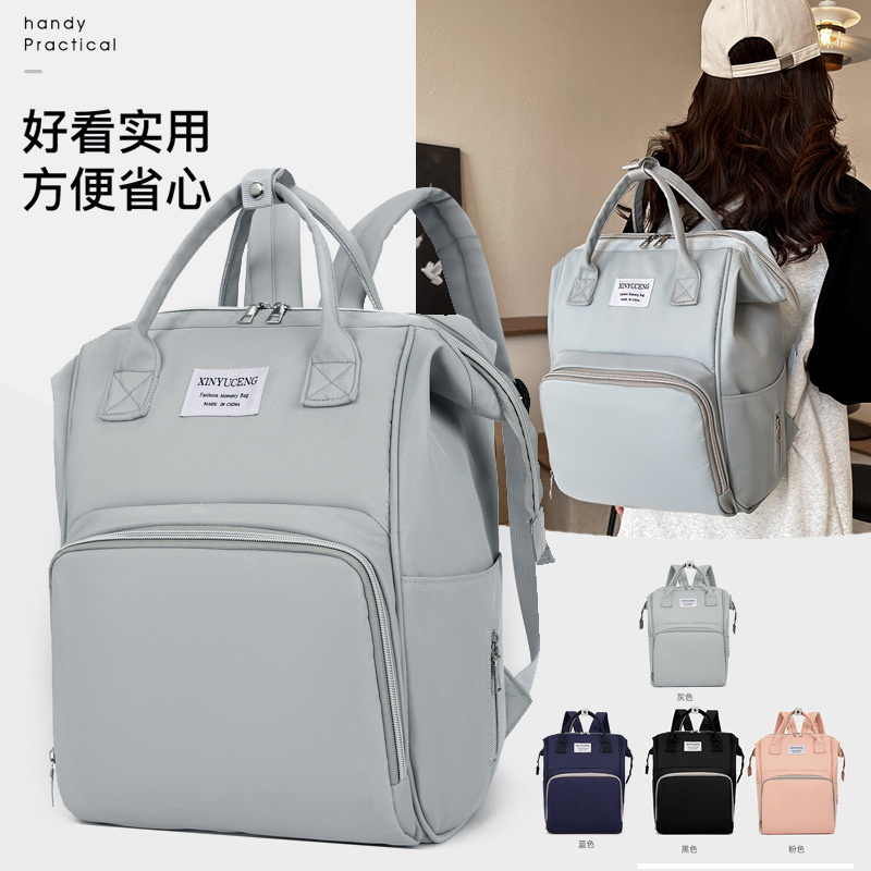 Solid-color lightweight mom bag, a backpack for taking kids out, multi-functional large-capacity mother and baby bag for girls full figure