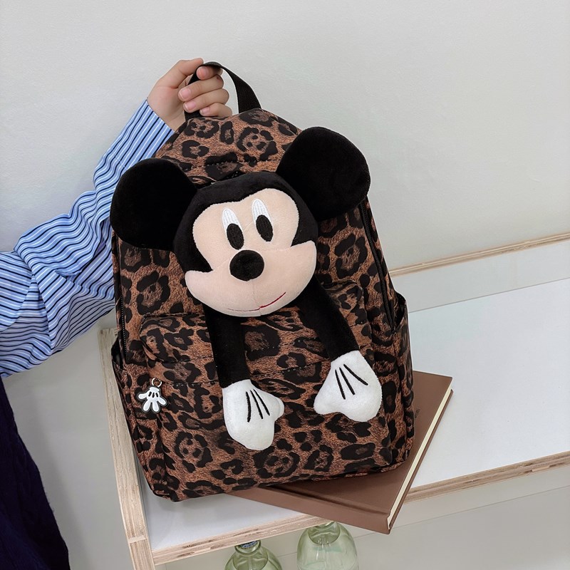 The 2025 new leopard-print backpack is a fashionable female figurine backpack with a large capacity and cute dolls. It is a best-selling student schoolbag details Picture