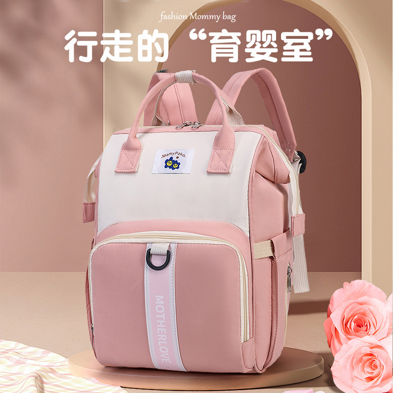 The new multi-functional baby and mother bag, Oxford Mom Bag, has a large capacity and can be used to carry strollers when going out. It is a backpack full figure